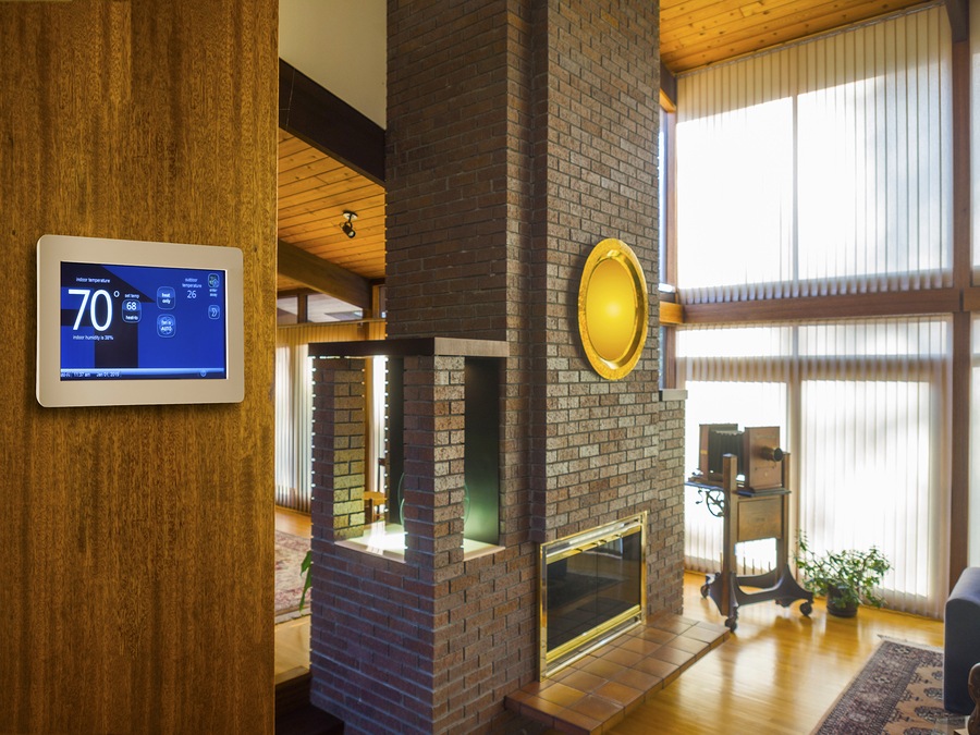 Programmable electronic thermostat for temperature control in living room hall way
