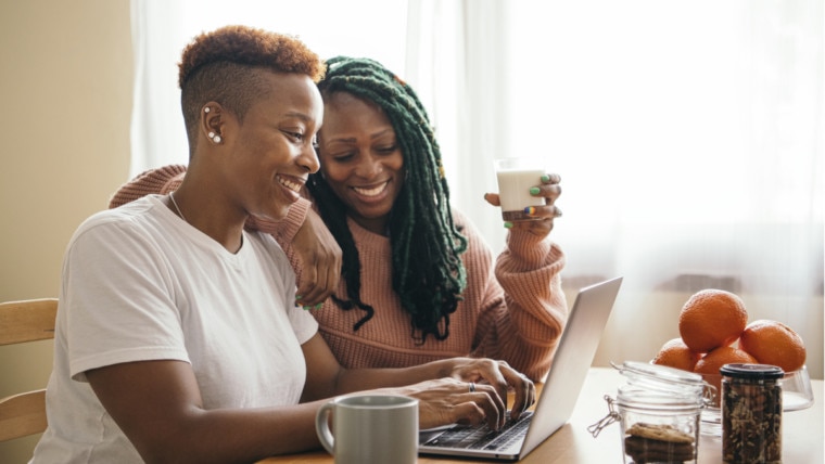 couple looking online to buy their first home