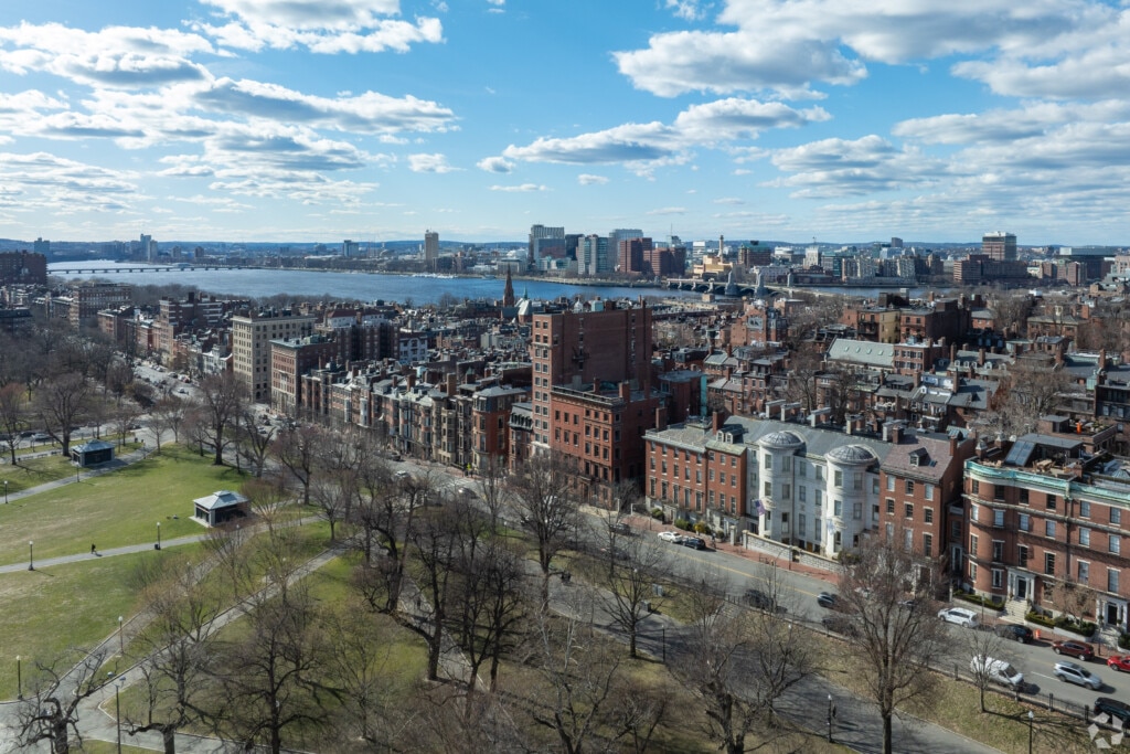 The edge of Boston Common and a view of the Charles River in the Beacon Hill neighborhood of Boston, Massachusetts. 