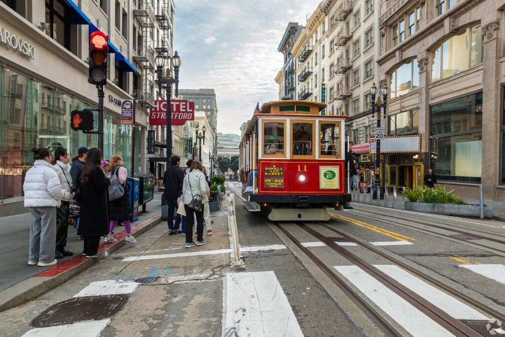 A cable car and waiting passengers in downtown San Francisco, California.