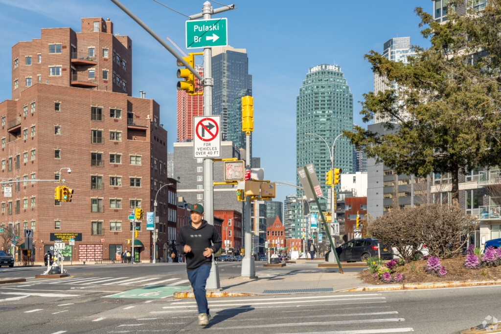 A man jogging in the Hunters Point neighborhood of Queens, NY.