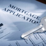 A mortgage application and the key to a house