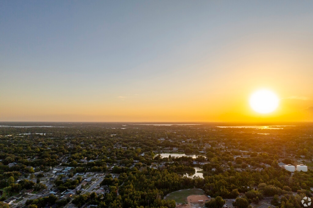 An aerial view of the sun shining brightly during sunset in Orlando, Florida.