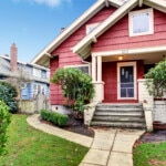 Classic craftsman old American house exterior in red and white during autumn. Northwest, USA