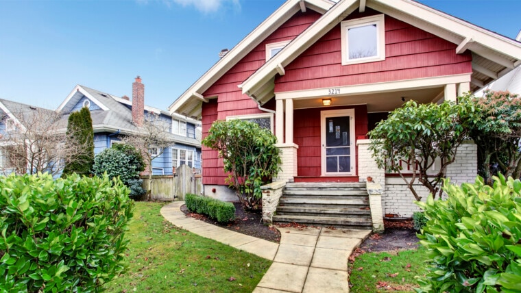 Classic craftsman old American house exterior in red and white during autumn. Northwest, USA